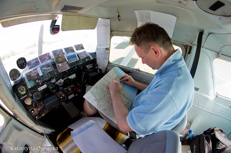 View inside cockpit as pilot checks route for World Air Rally Flying&nbsp;championships